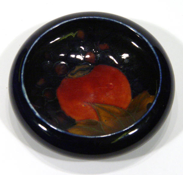 Appraisal: Moorcroft Pottery dish hand painted and tubelined with pomegranate pattern