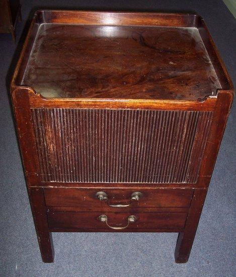 Appraisal: A late th Century mahogany tray top bedside cupboard with