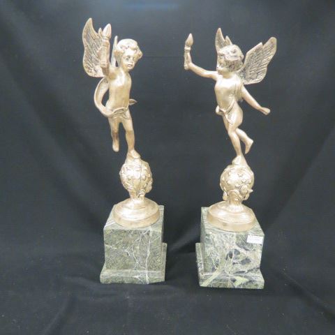 Appraisal: Pair of Silvered Bronze Statues of Cherubs green marble bases