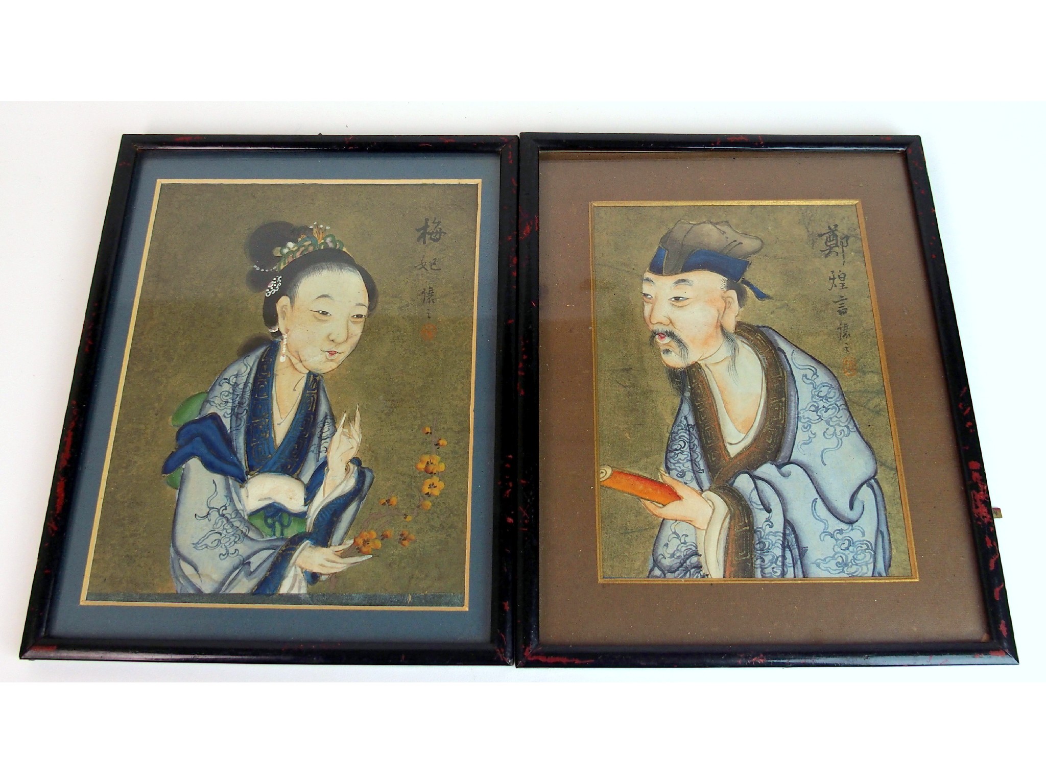 Appraisal: A pair of Chinese watercolour drawings of a gentleman and