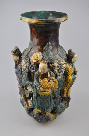 Appraisal: Chinese stoneware reticulated baluster vase decorated in relief with four