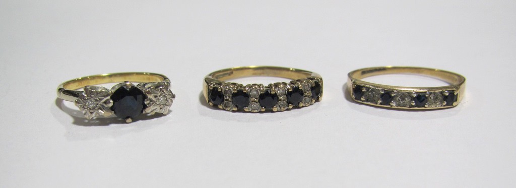 Appraisal: Lot comprising two ct gold sapphire and diamond half hoop