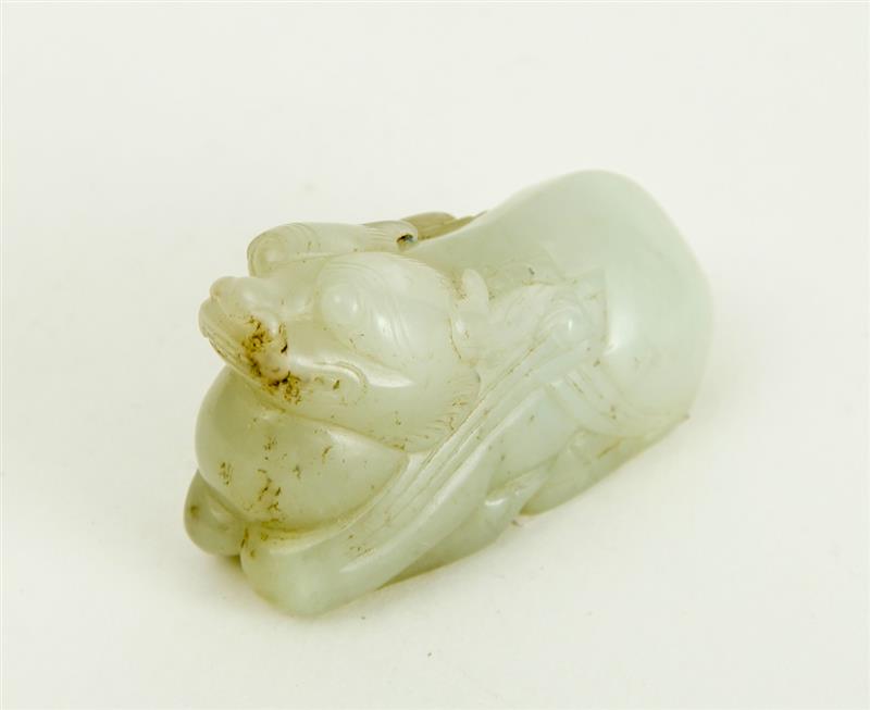 Appraisal: CHINESE CARVED PALE GREEN JADE FIGURE OF A RECUMBENT FU