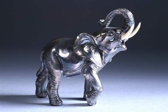 Appraisal: STERLING SILVER FIGURE OF ELEPHANT WITH IVORY TUSKS Probably Middle