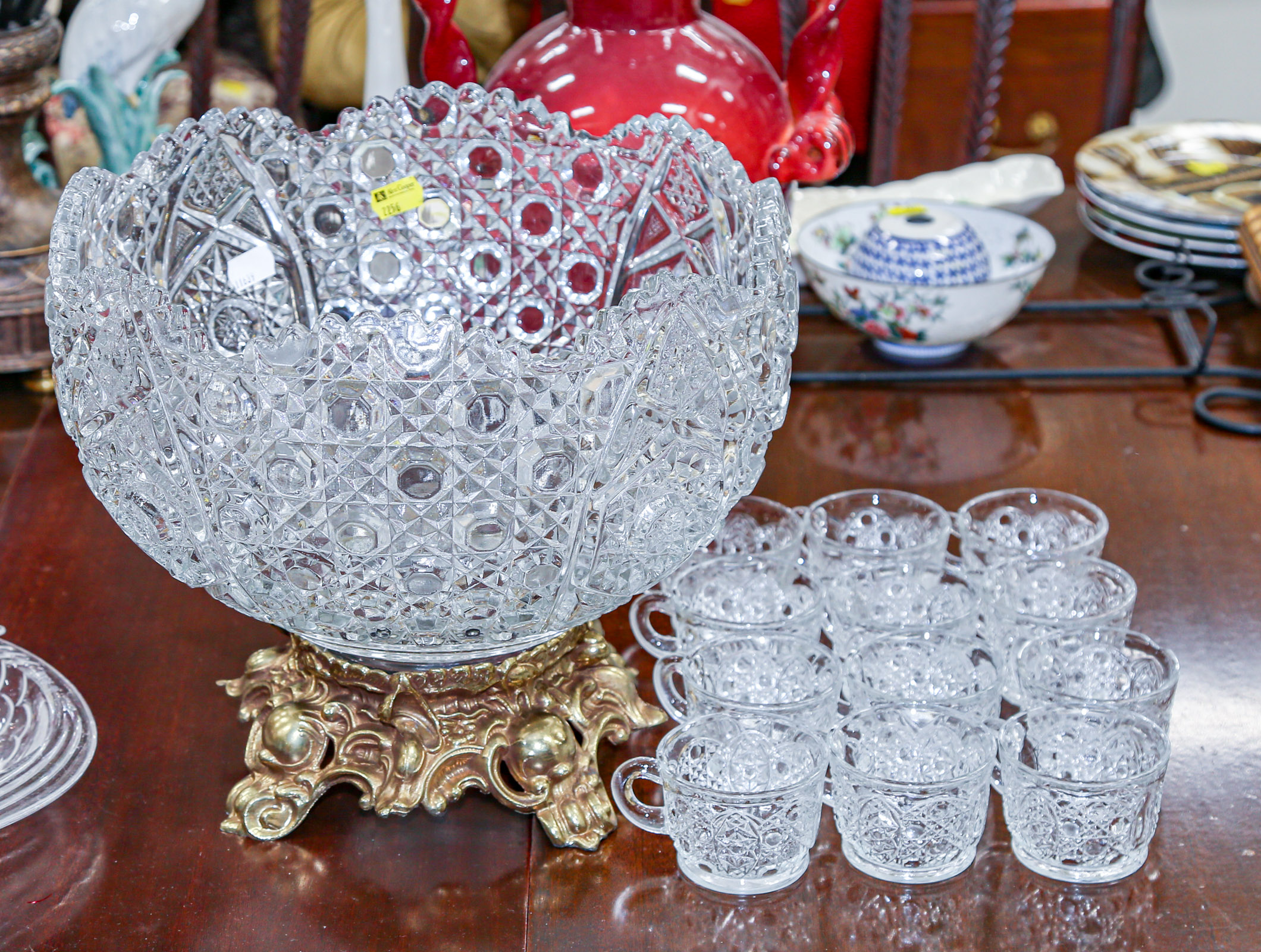 Appraisal: PRESSED GLASS PUNCH BOWL ON METAL STAND With cups in