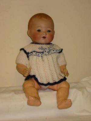 Appraisal: An Armand Marseille bisque head baby doll with blue glass