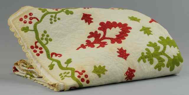 Appraisal: APPLIQUE QUILT Designed with red and green ornate designs th