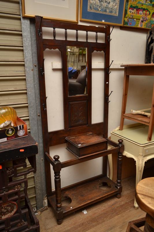 Appraisal: AN EDWARDIAN MIRROR BACKED HALL STAND AN EDWARDIAN MIRROR BACKED