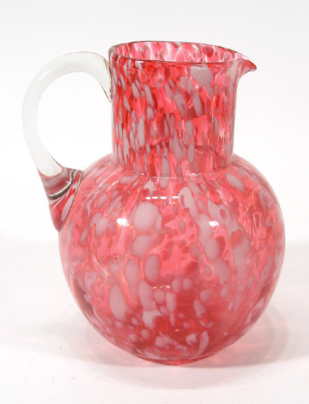 Appraisal: White flecked Cranberry glass jug with clear handle cm high