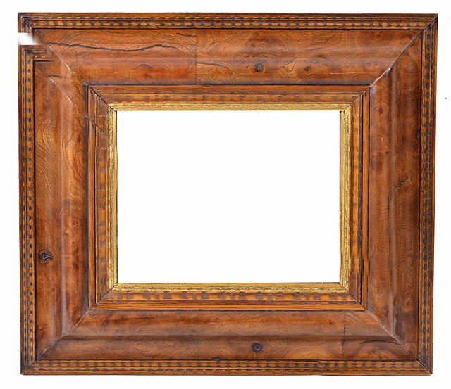 Appraisal: A FLEMISH STYLE BURR ELM FRAME of cushion moulded form