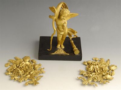 Appraisal: A th century ormolu model of cupid standing holding his