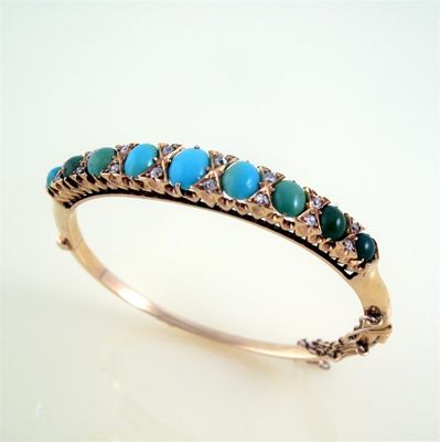 Appraisal: An Edwardian turquoise and diamond hinged bangle the oval turquoise