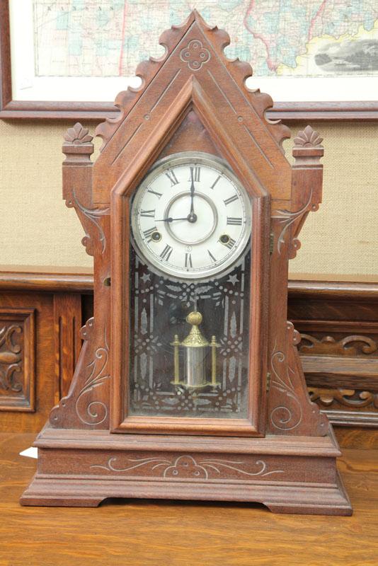 Appraisal: STEEPLE CLOCK Eight day time strike with brass works tin