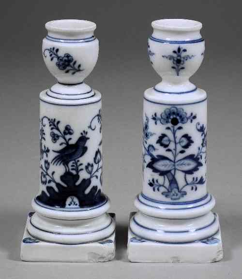 Appraisal: Two Meissen candlesticks painted in blue one with a bird