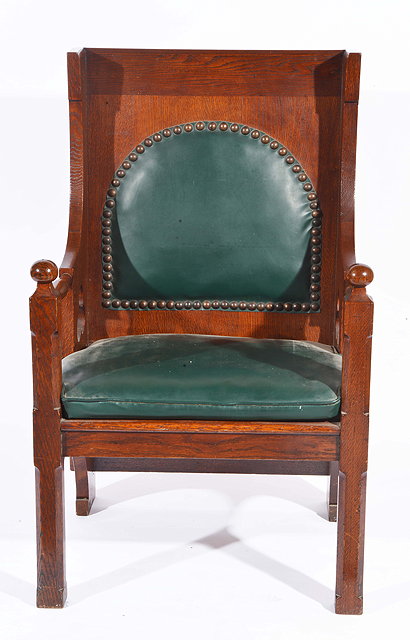 Appraisal: Liberty Co of LondonAn oak throne chair padded brass-studded leather