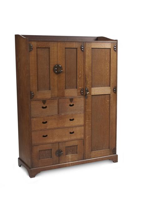 Appraisal: GEORGE WALTON WARDROBE CIRCA oak the three-quarter galleried top above