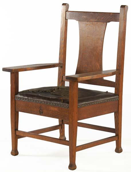 Appraisal: ROYCROFT Armchair with tacked-on leather seat and Macmurdo feet Carved