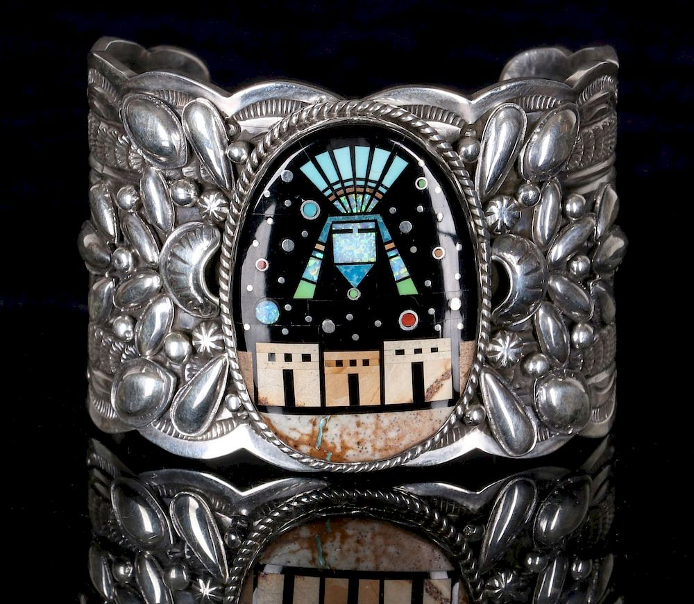 Appraisal: A GILBERT TOM STERLING CUFF WITH NIGHTTIME PUEBLO A wide