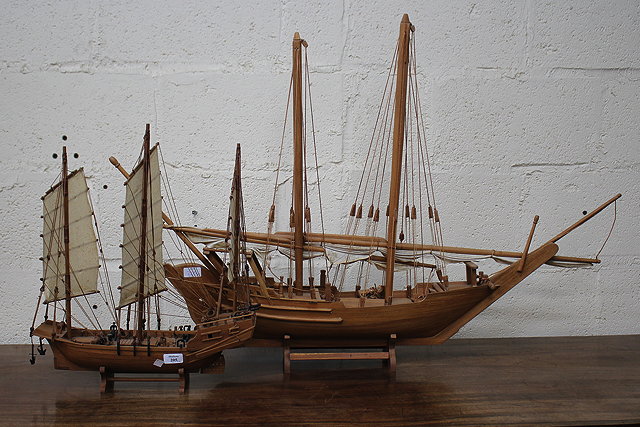 Appraisal: TWO HARDWOOD MODEL SAILING BOATS made in Thailand the largest