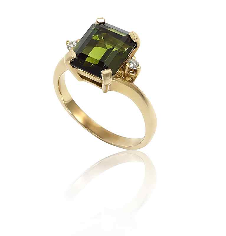 Appraisal: GREEN EMERALD CUT TOURMALINE AND DIAMOND RING k yellow gold