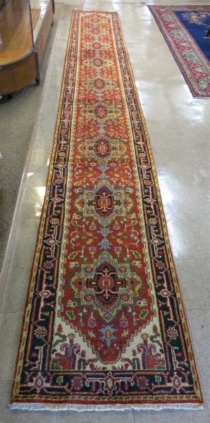 Appraisal: HAND KNOTTED ORIENTAL LONG RUG Persian Serapi design of repeating