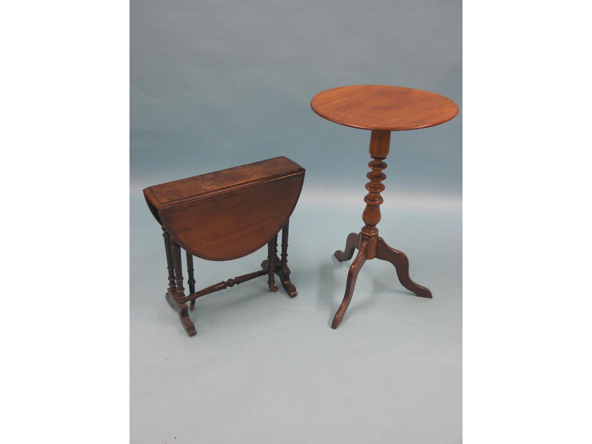 Appraisal: A Victorian mahogany wine table circular top on turned tripod