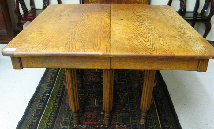 Appraisal: SQUARE OAK DINING TABLE American c standing on six square