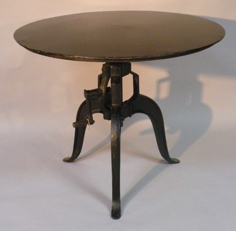 Appraisal: A thC metal frame adjustable crank table the circular top