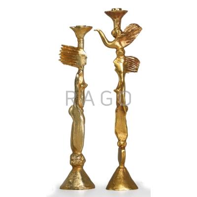 Appraisal: PIERRE CASENOVE FONDICA Two gold-plated metal candlesticks France CASENOVE FONDICA