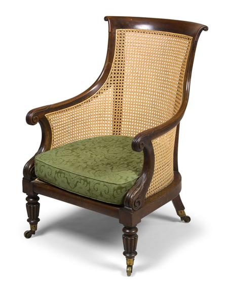 Appraisal: A George IV mahogany and caned bergere armchair circa on