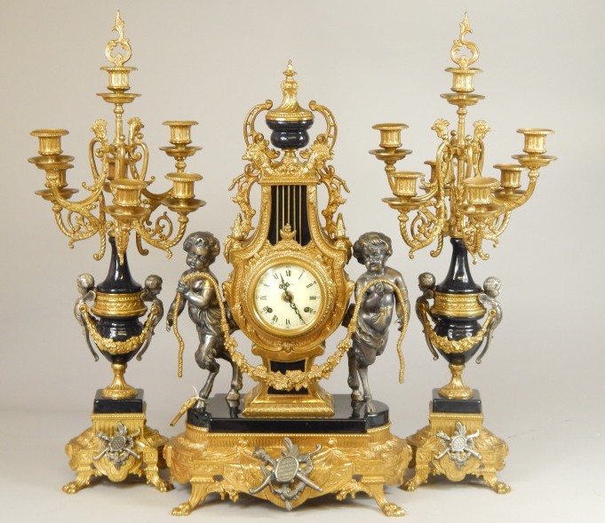 Appraisal: A thC French style gilt metal clock garniture the lyre