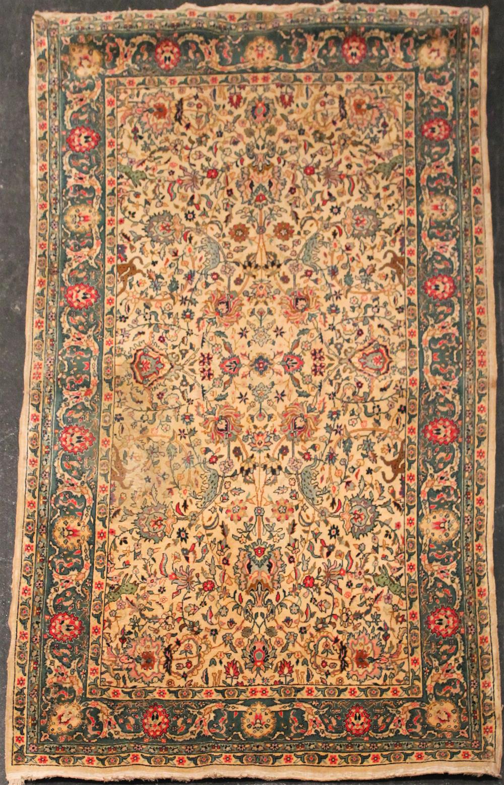 Appraisal: OLD 'S PERSIAN TABRIZ cream background with intertwining flora surrounded