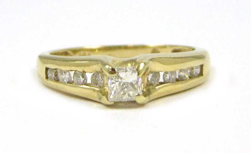 Appraisal: DIAMOND AND FOURTEEN KARAT GOLD RING with four round-cut diamonds