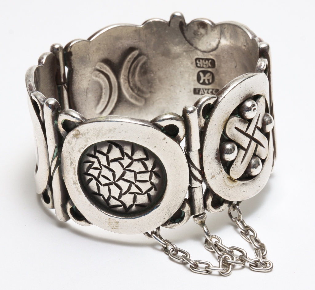 Appraisal: HECTOR AGUILAR AZTEC METAL SYMBOLS CUFF Mexico mid- th century