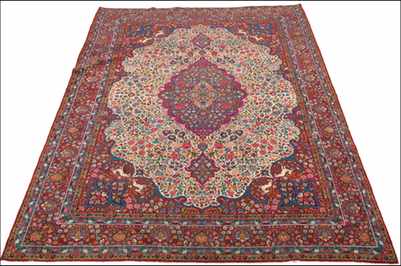 Appraisal: A Large Tabriz Hunting Carpet Central medallion in ivory field