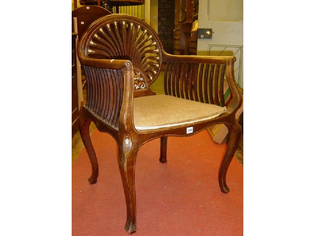 Appraisal: An Edwardian mahogany occasional chair with stylised lath decoration with