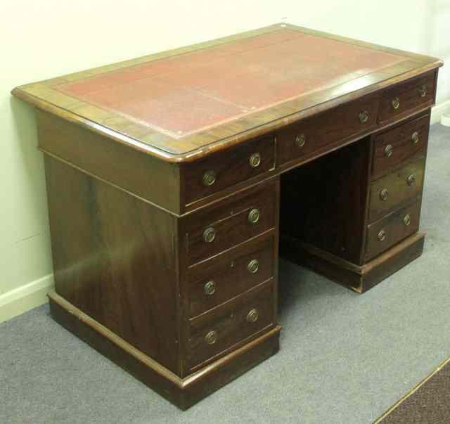 Appraisal: A late Victorian mahogany pedestal writing desk with tooled leather