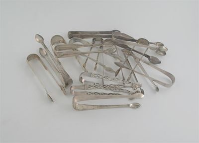 Appraisal: Sixteen pairs of sugar tongs including three George III IV