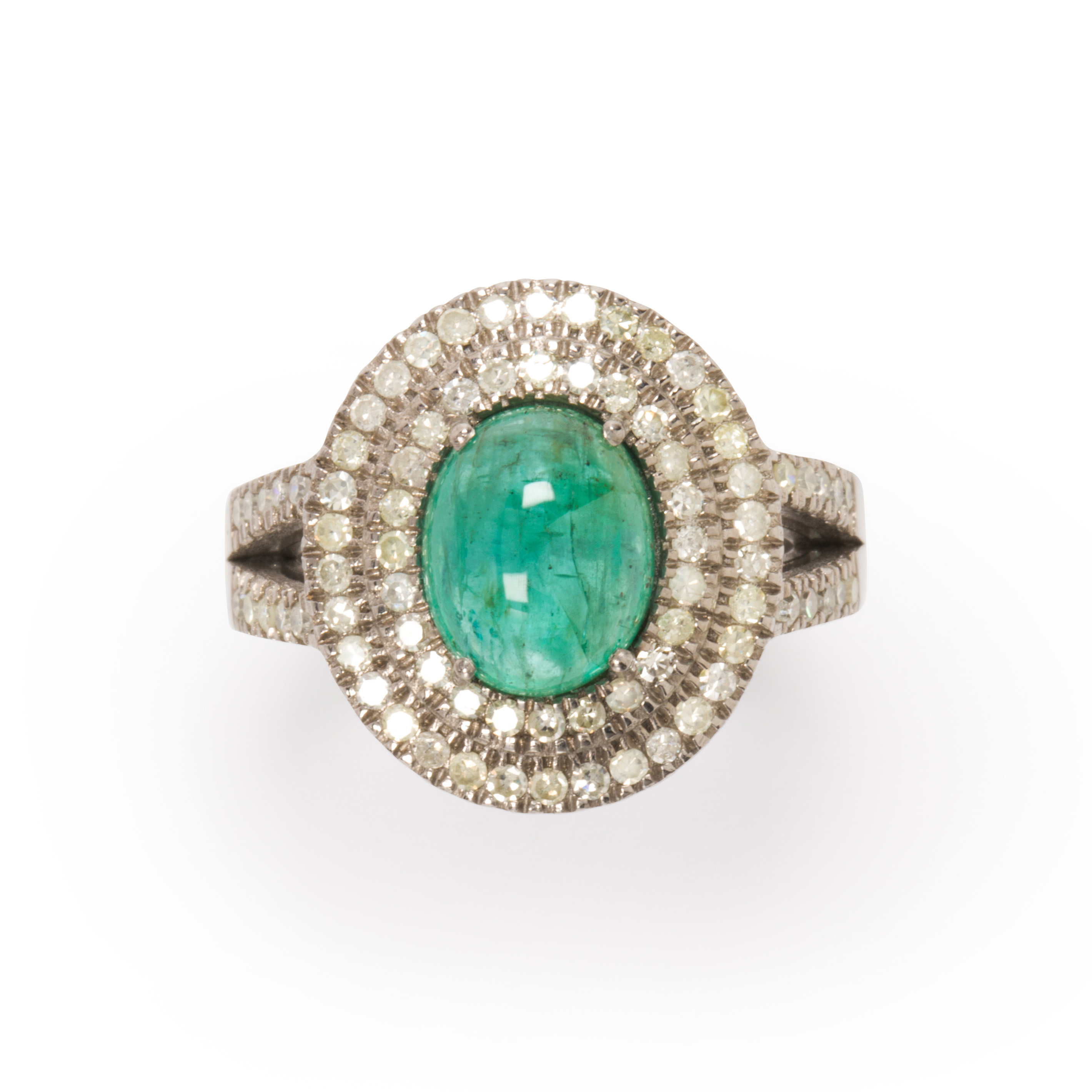 Appraisal: AN EMERALD AND DIAMOND RING An emerald and diamond ring