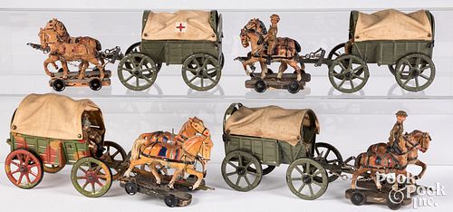 Appraisal: ELASTOLIN HORSE DRAWN MILITARY WAGONSElastolin horse drawn military wagons to