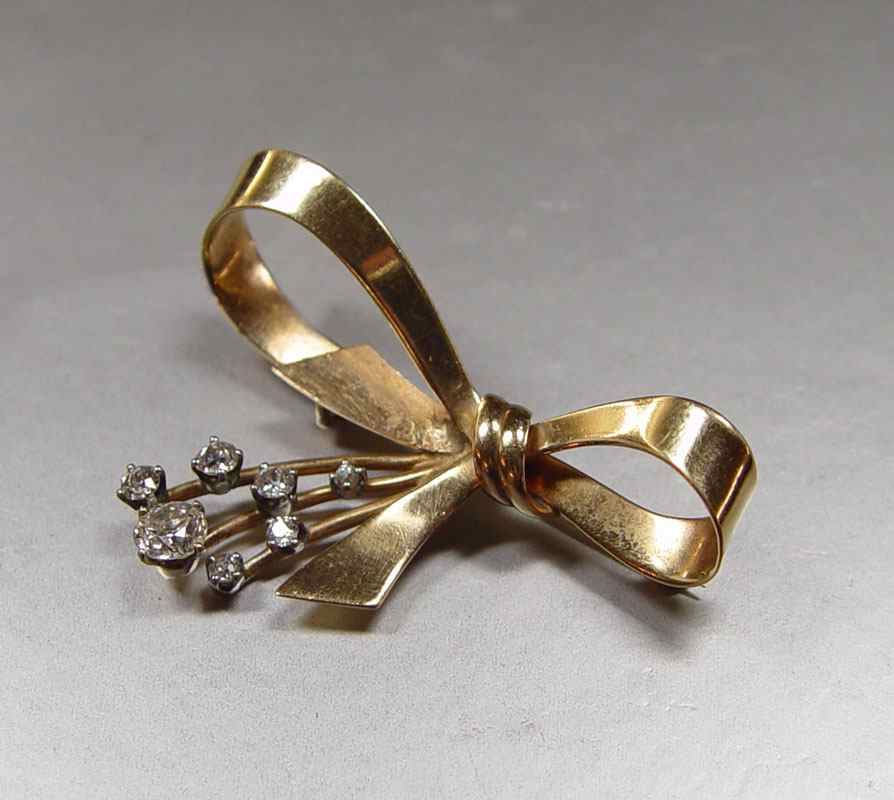 Appraisal: OLD MINE AND EUROPEAN CUT DIAMOND ''BOW'' BROOCH K yellow