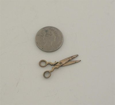 Appraisal: A pair of th century coppergilt miniature or toy scissors