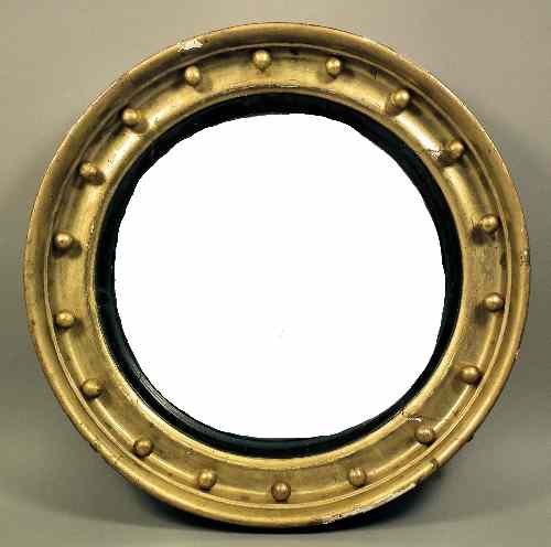 Appraisal: A late Georgian gilt framed circular convex wall mirror ins