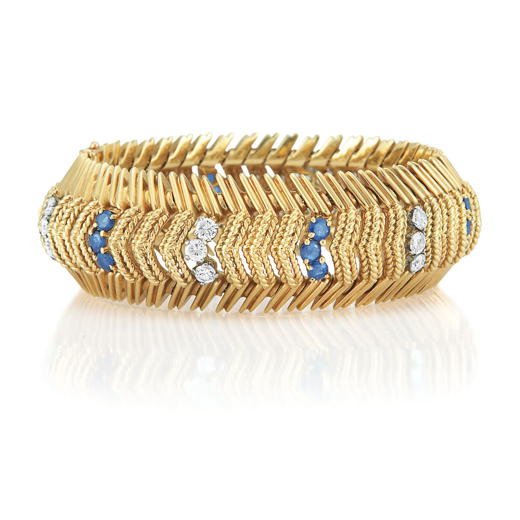 Appraisal: Gold Diamond and Sapphire Bracelet Centering gold rope-twist chevron links