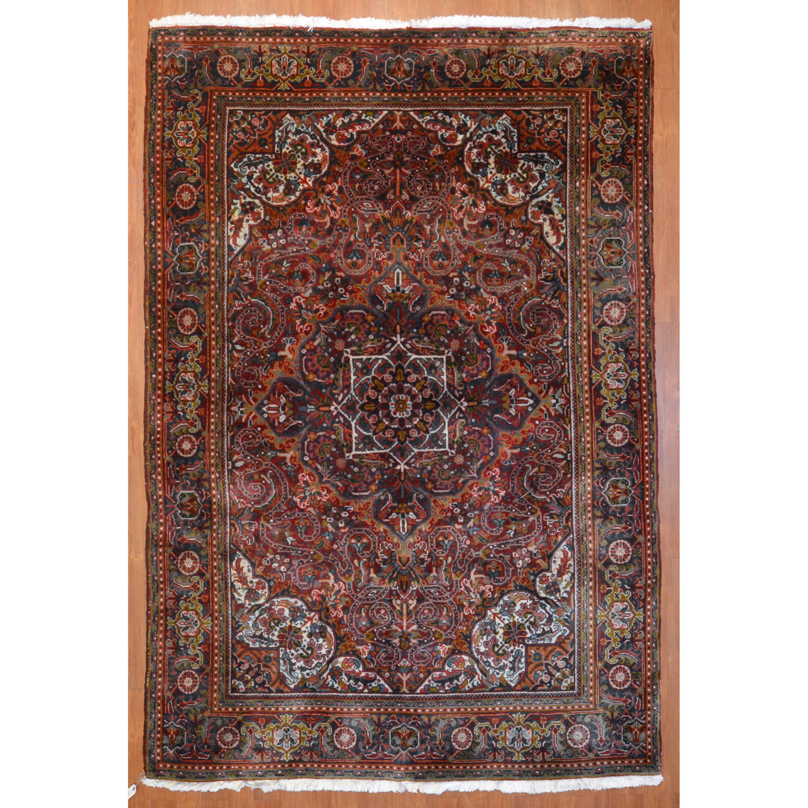 Appraisal: HERIZ RUG PERSIA X Fourth quarter- th century hand-knotted wool