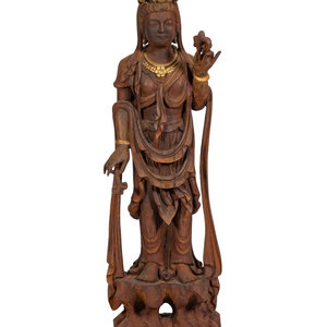 Appraisal: A Carved and Gilt Guanyin Statue th Century carved and