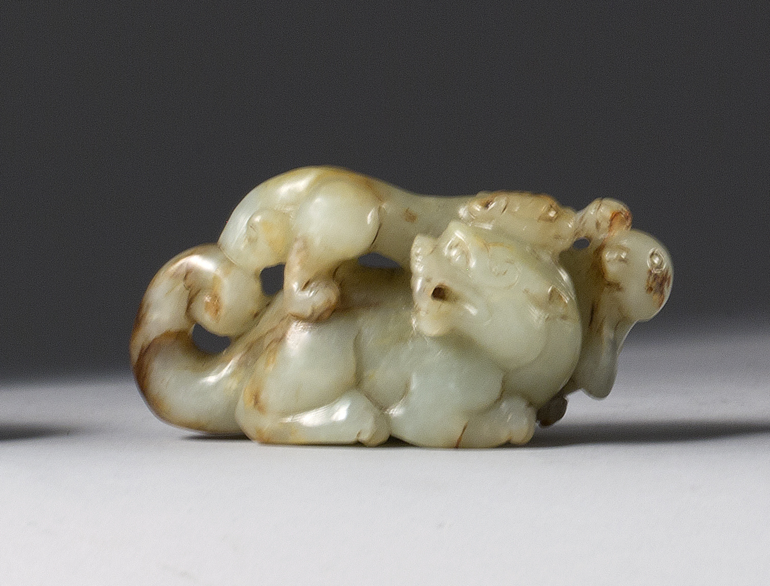 Appraisal: GRAY AND RUSSET JADE CARVING th CenturyIn the form of