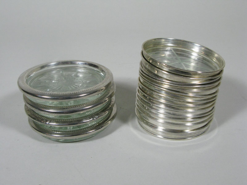 Appraisal: Seventeen Sterling Glass Coasters glass centers with sterling silver bands