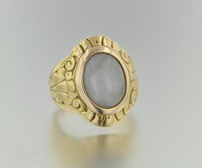 Appraisal: A Handcrafted Gold Ring with Grey Color Star Sapphire Tested