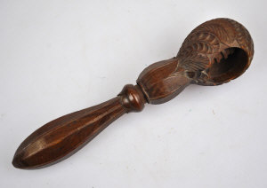 Appraisal: A late th century walnut nut cracker carved as a